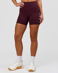Woman wearing Rep Ultra High-Rise 4" Short Pockets - Cherry Lacquer-White | Model:Issy | Size:XS | Thumbnail Index: 1