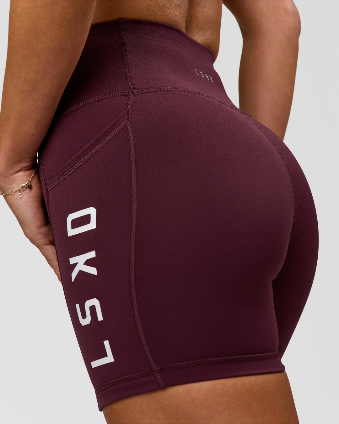 Woman wearing Rep Ultra High-Rise 4" Short Pockets - Cherry Lacquer-White | Model:Issy | Size:XS - view 7