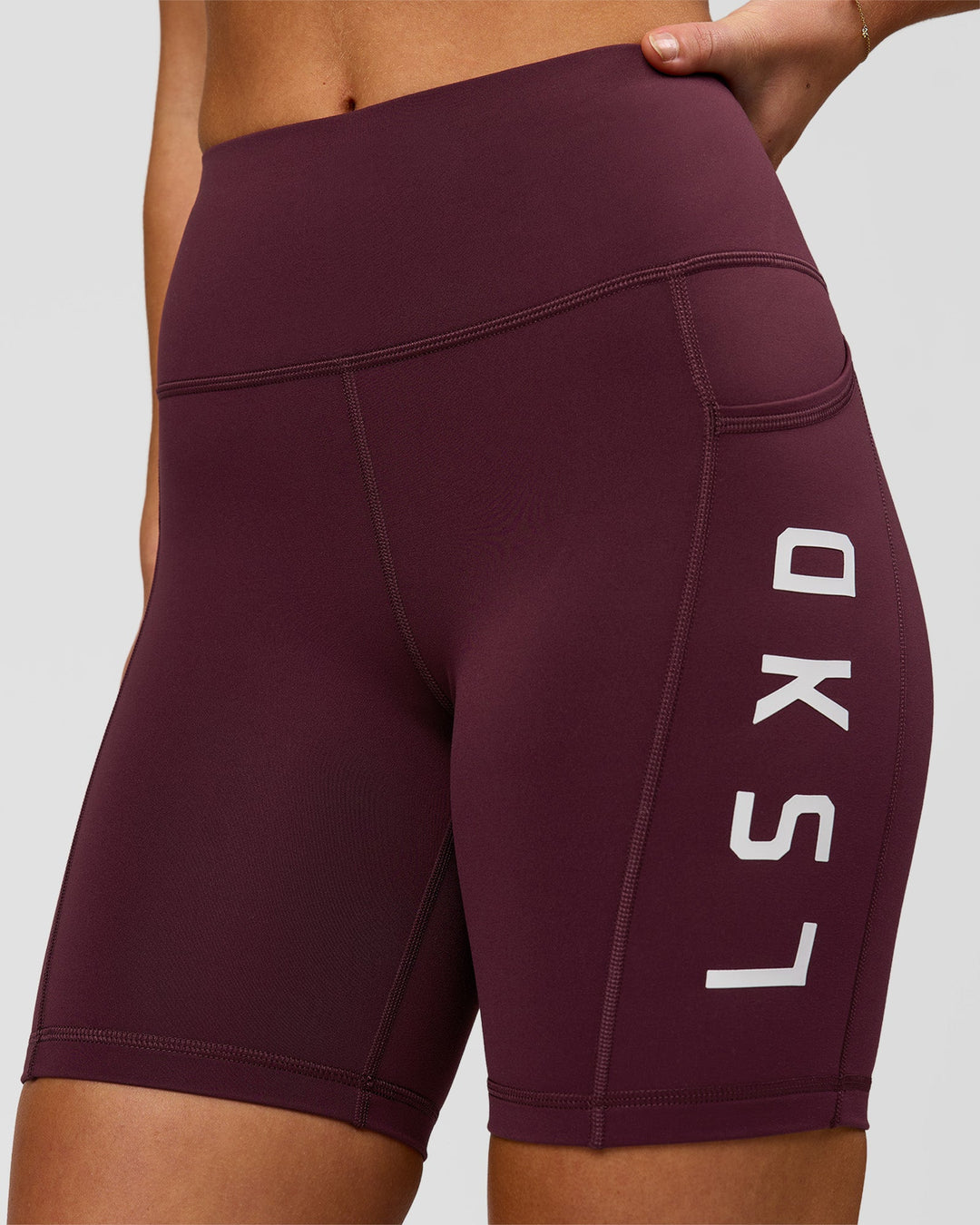 Woman wearing Rep Ultra High-Rise 6" Short Pockets - Cherry Lacquer-White | Model:Issy | Size:XS - view 2