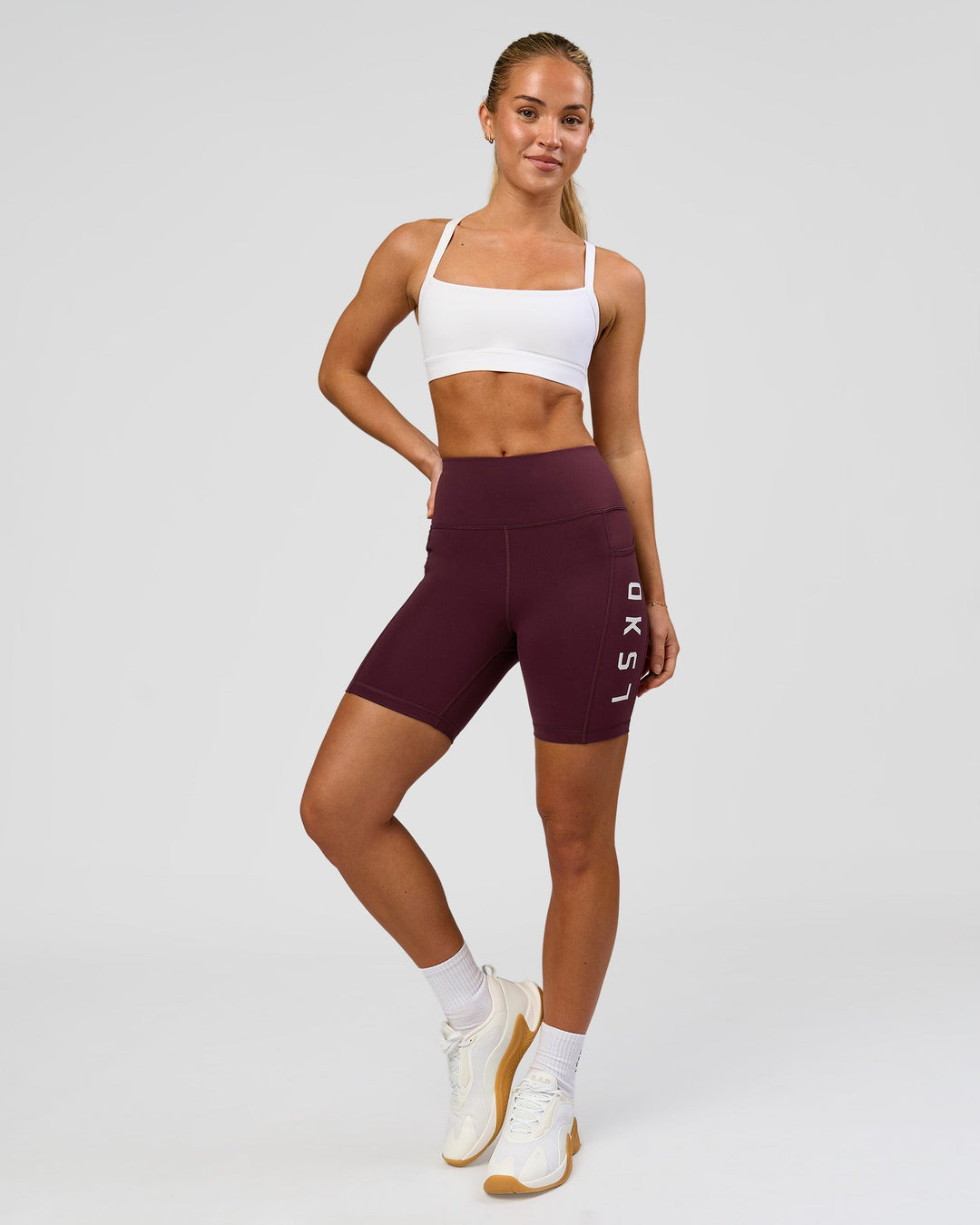 Woman wearing Rep Ultra High-Rise 6" Short Pockets - Cherry Lacquer-White | Model:Issy | Size:XS - view 8