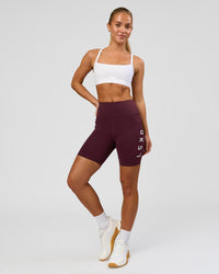 Woman wearing Rep Ultra High-Rise 6" Short Pockets - Cherry Lacquer-White | Model:Issy | Size:XS | Thumbnail Index: 7