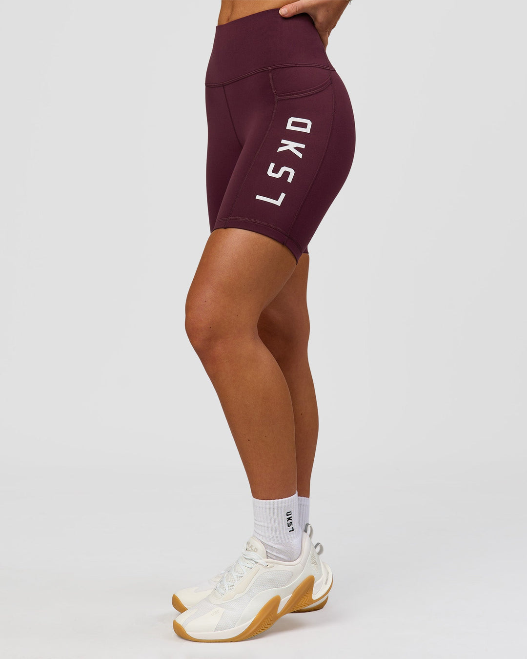Woman wearing Rep Ultra High-Rise 6" Short Pockets - Cherry Lacquer-White | Model:Issy | Size:XS - view 9