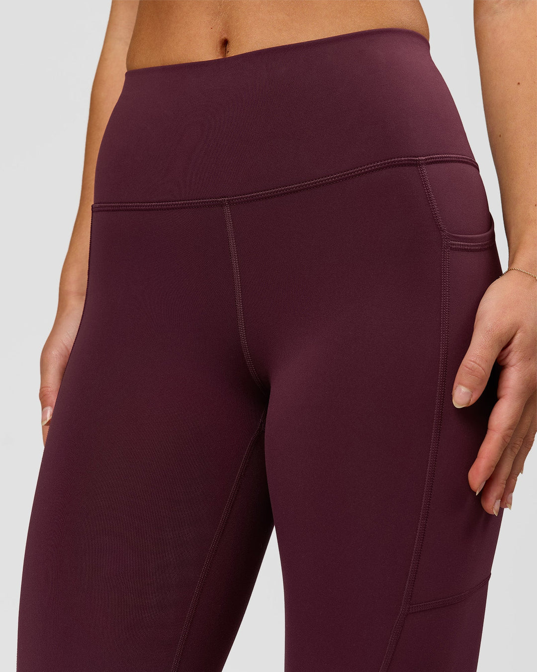 Woman wearing Rep Ultra High-Rise 7/8 Legging Pockets - Cherry Lacquer-White | Model:Issy | Size:XS - view 5