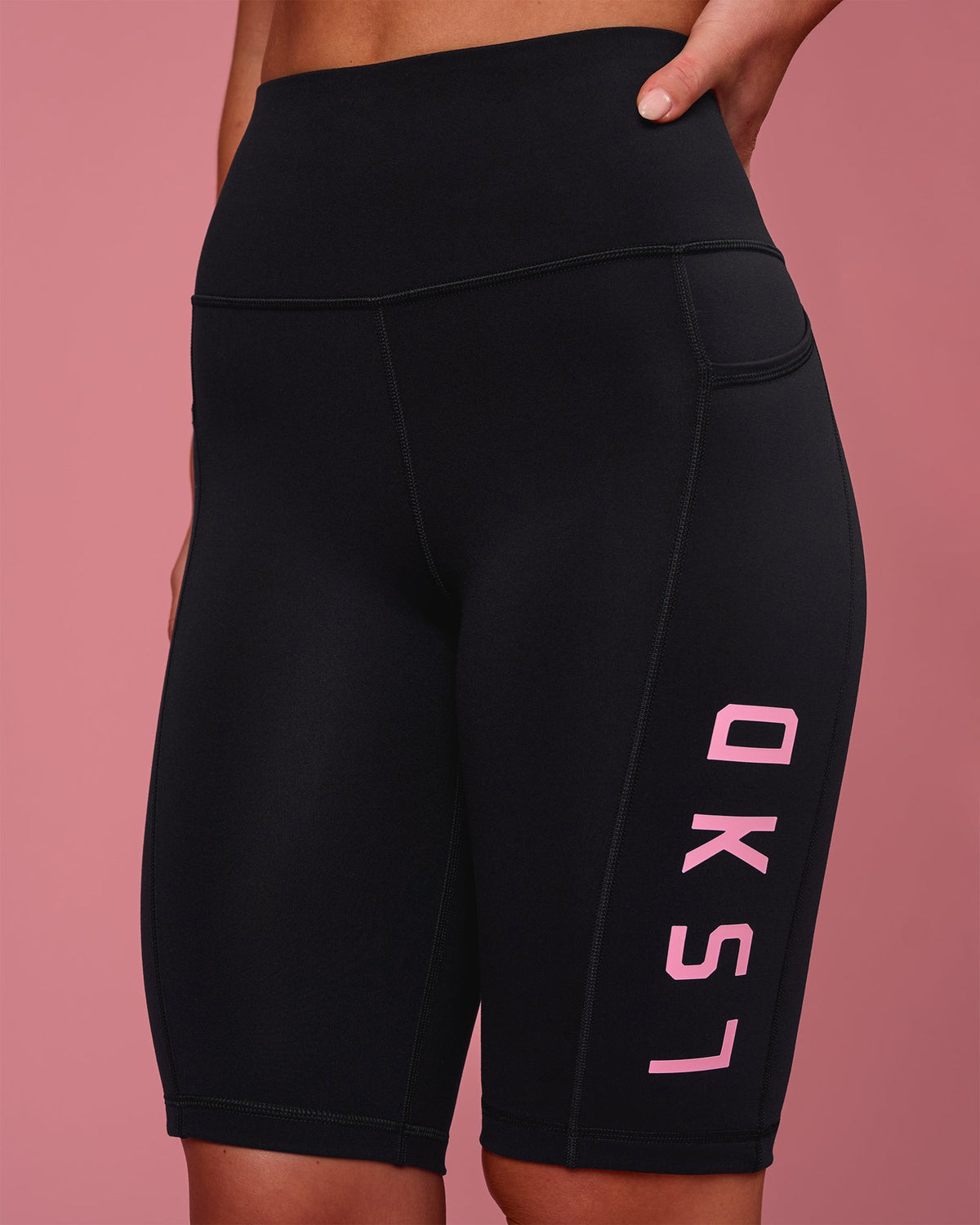 Woman wearing Rep Ultra High-Rise 9" Short Pockets - Black-Pink Rose | Model:Issy | Size:XS - view 2