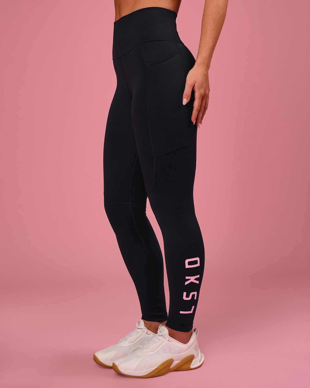 Woman wearing Rep Ultra High-Rise Full Length Legging Pockets - Black-Pink Rose | Model:Issy | Size:XS - view 1