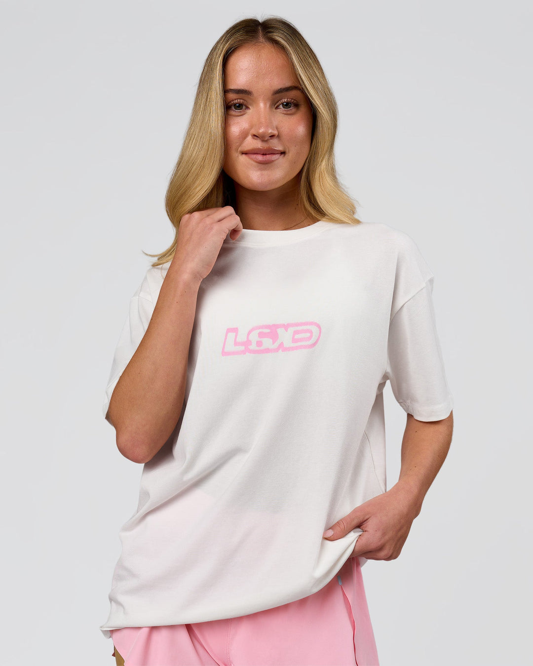 Woman wearing SoCal 26 FLXCotton Oversize Tee  - Off White-Pink Rose | Model:Issy | Size:XS - view 11