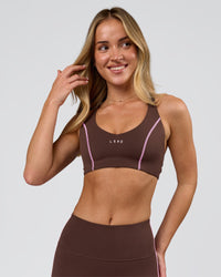 Woman wearing Stellar Sports Bra - Hot Chocolate-Pink Rose | Model:Issy | Size:XS | Thumbnail Index: 9