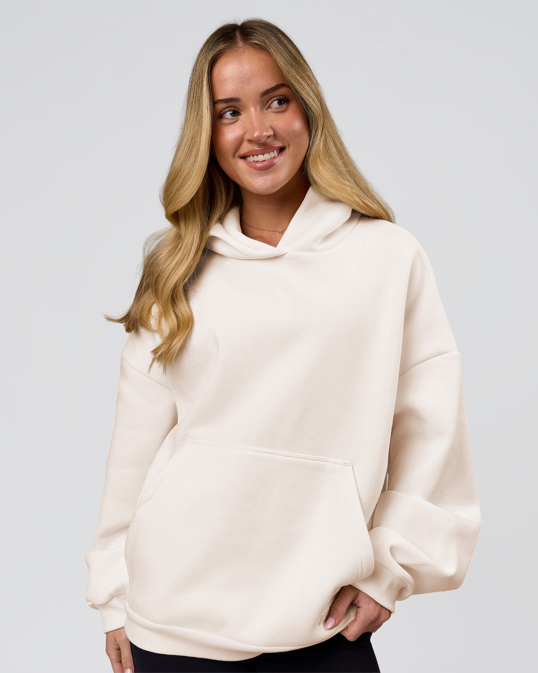 Woman wearing Tonal Legacy Boxy Hoodie - Off White-Off White | Model:Issy | Size:XS - view 6