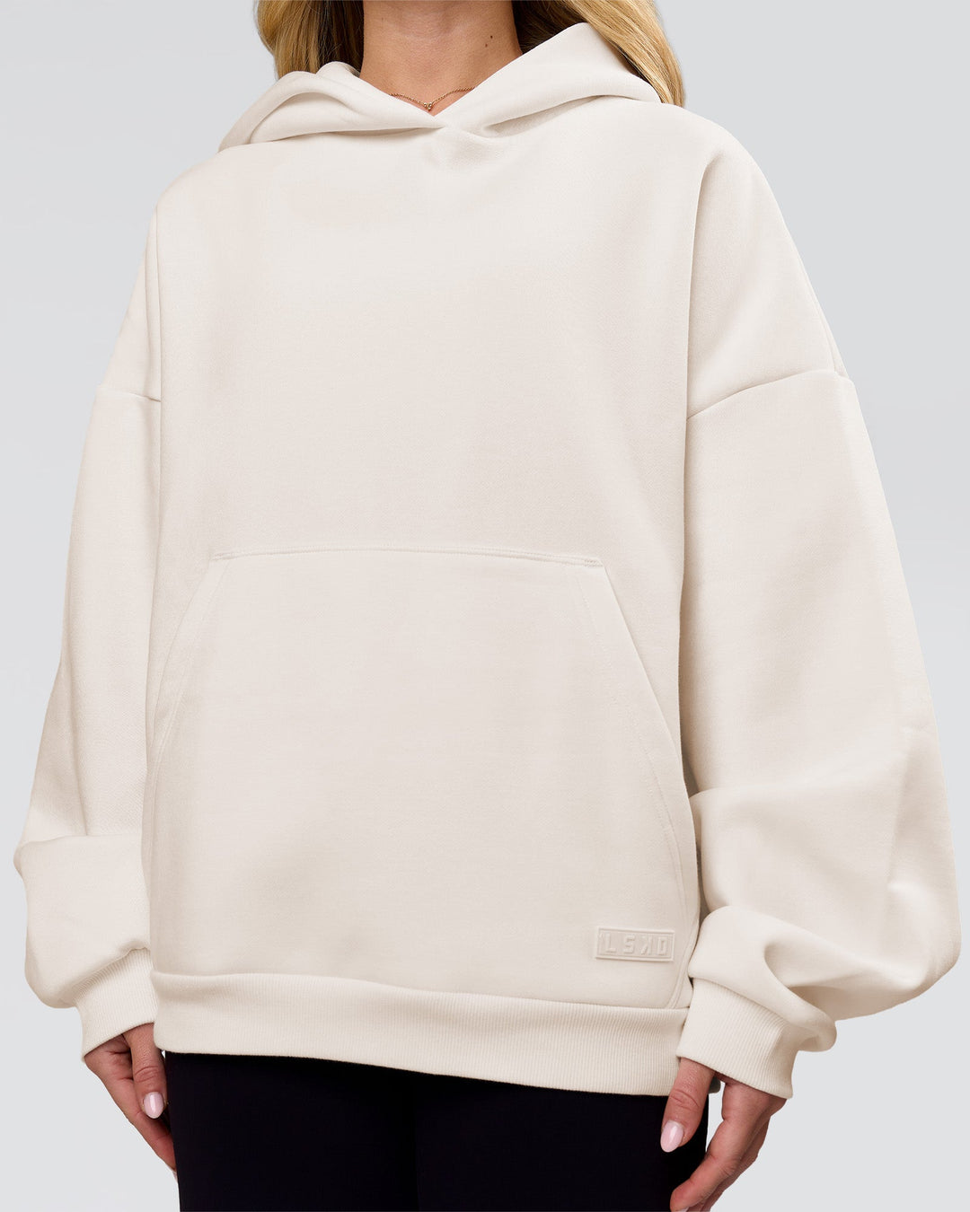 Woman wearing Tonal Legacy Boxy Hoodie - Off White-Off White | Model:Issy | Size:XS - view 12