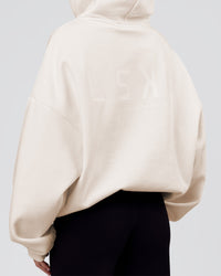 Woman wearing Tonal Legacy Boxy Hoodie - Off White-Off White | Model:Issy | Size:XS | Thumbnail Index: 13
