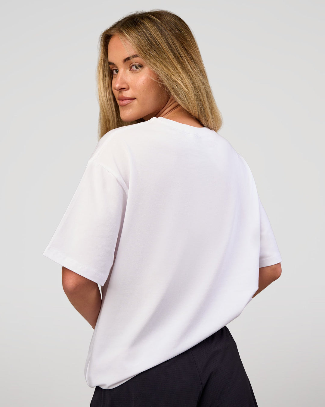 Woman wearing VS1 Enjoy The Journey FLXCotton Oversize Tee - White | Model:Issy | Size:XS - view 5