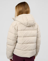 Woman wearing Go-To Puffer Jacket - Shale Beige | Model:Izzy | Size:XS | Thumbnail Index: 1