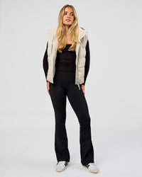 Woman wearing Go-To Puffer Vest - Shale Beige | Model:Izzy | Size:XS | Thumbnail Index: 2