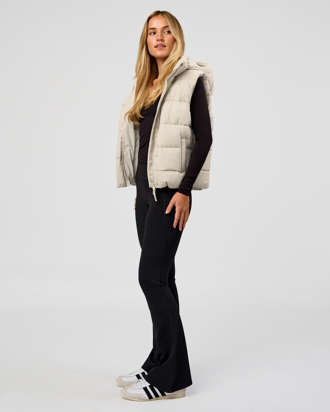 Woman wearing Go-To Puffer Vest - Shale Beige | Model:Izzy | Size:XS - view 5