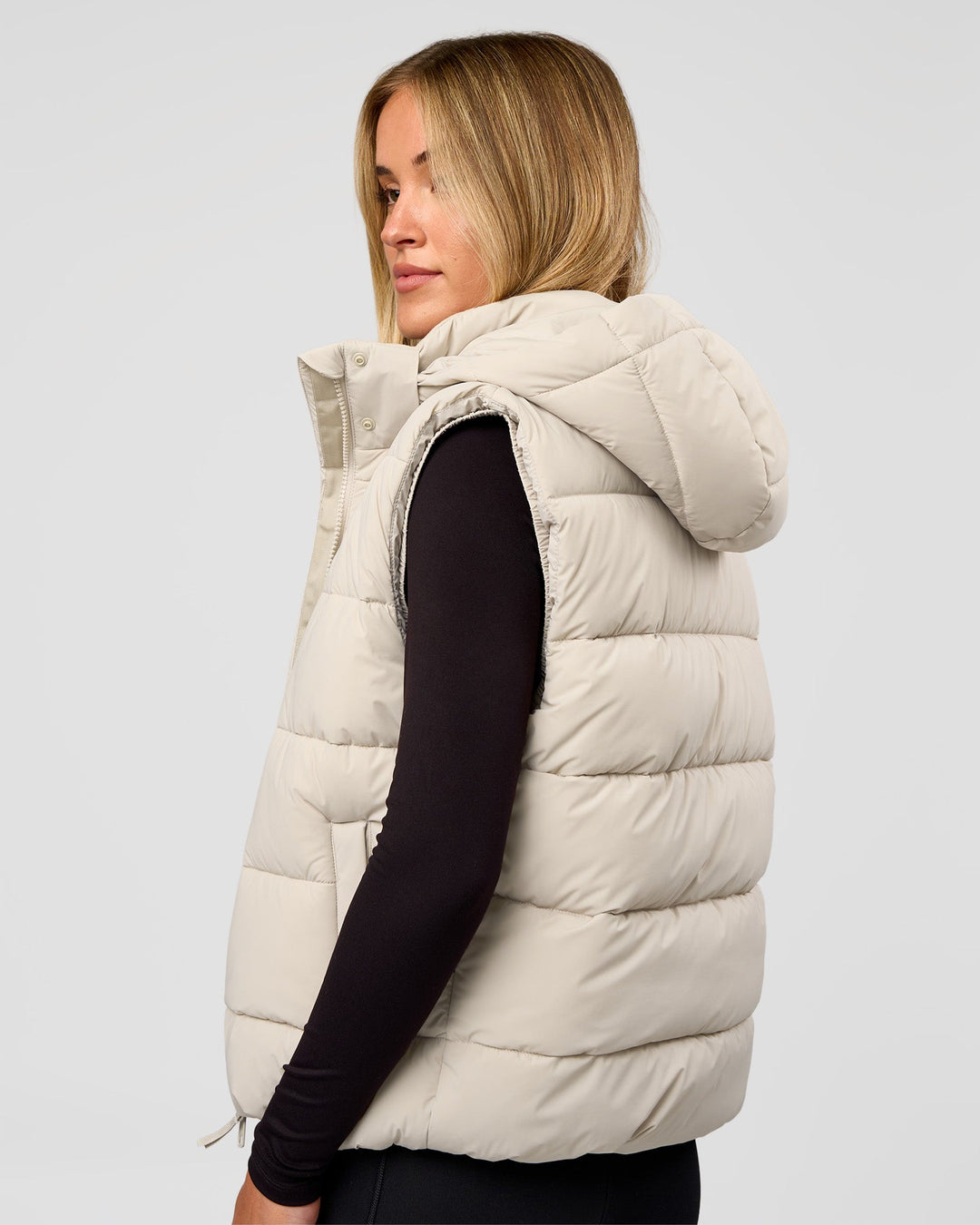 Woman wearing Go-To Puffer Vest - Shale Beige | Model:Izzy | Size:XS - view 2