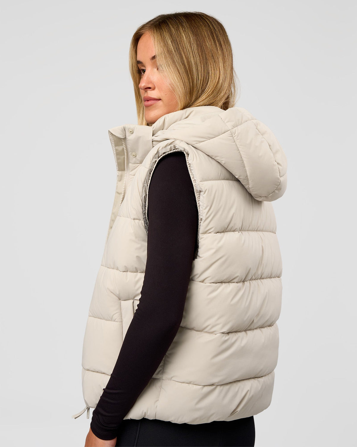 Woman wearing Go-To Puffer Vest - Shale Beige | Model:Izzy | Size:XS - view 2