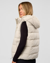 Woman wearing Go-To Puffer Vest - Shale Beige | Model:Izzy | Size:XS | Thumbnail Index: 1
