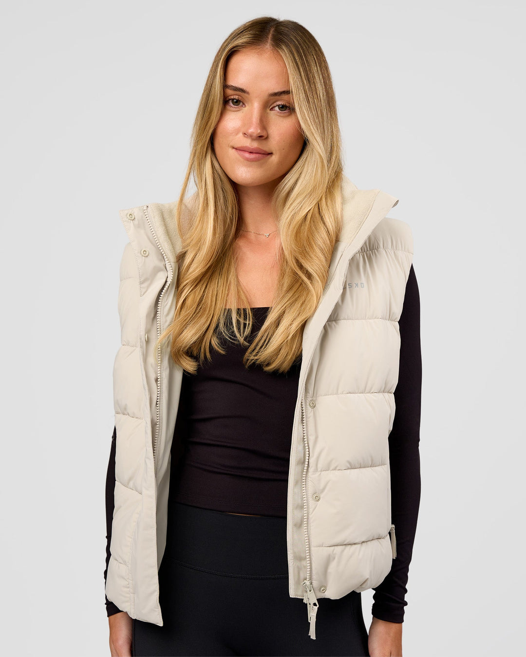 Woman wearing Go-To Puffer Vest - Shale Beige | Model:Izzy | Size:XS - view 7