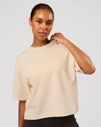 Woman wearing AfterDark ZeroCrease Cropped Tee - Vanilla Bean | Model:Jordan | Size:XS | Thumbnail Index: 0