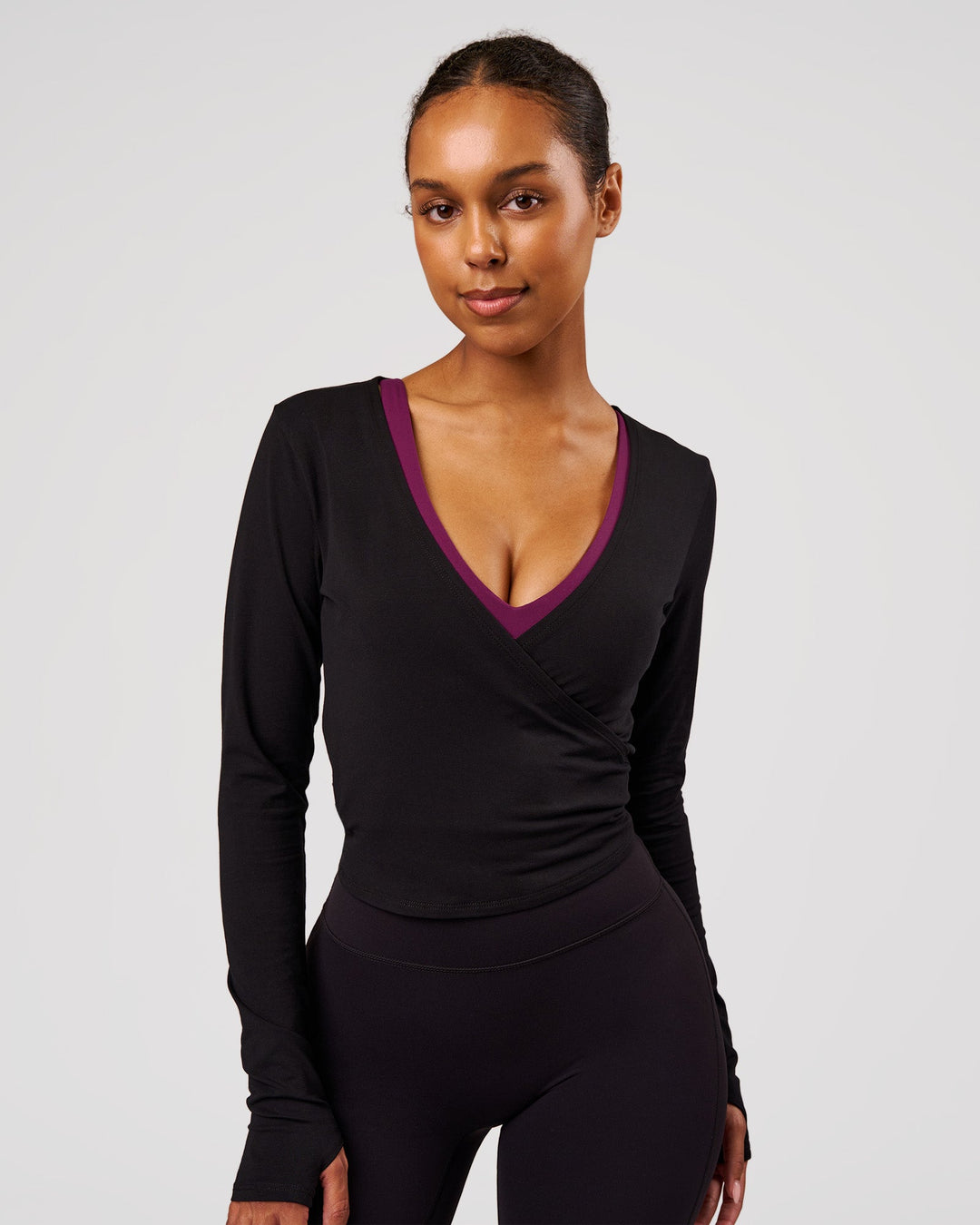 Woman wearing All Day Wrap FLXCotton Long Sleeve Top - Black | Model:Jordan | Size:XS - view 1