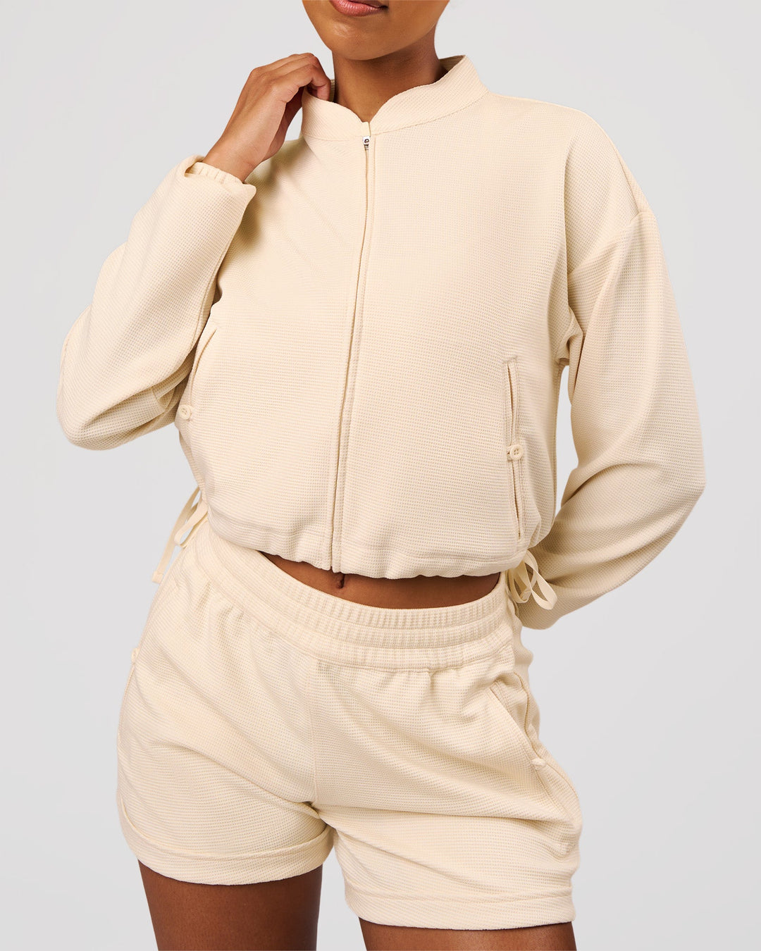 Woman wearing CloudWaffle Midi Zip Up - Vanilla Bean | Model:Jordan | Size:XS - view 3