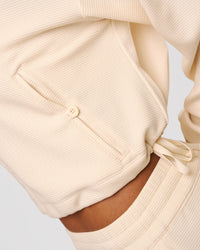Woman wearing CloudWaffle Midi Zip Up - Vanilla Bean | Model:Jordan | Size:XS | Thumbnail Index: 4