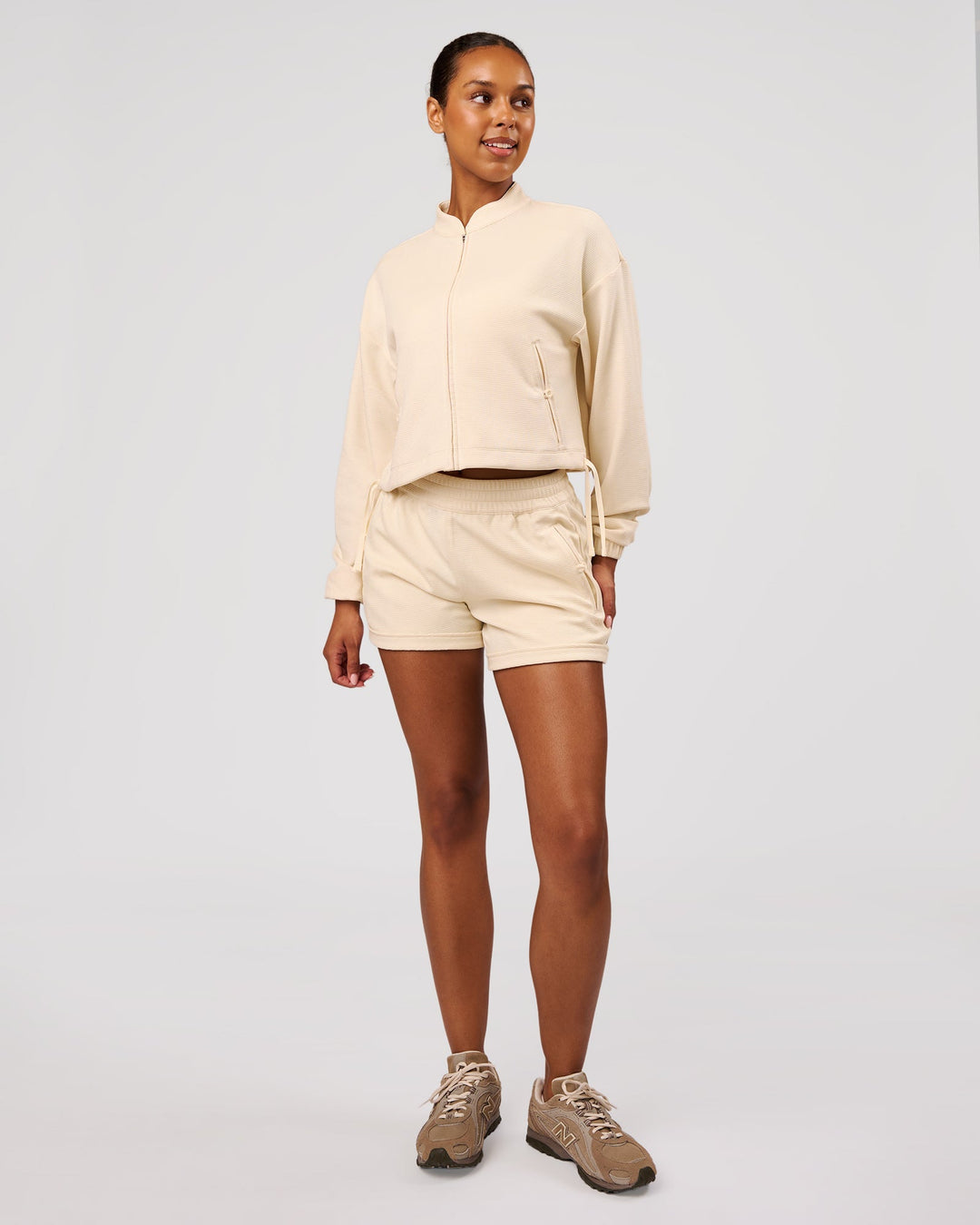 Woman wearing CloudWaffle Midi Zip Up - Vanilla Bean | Model:Jordan | Size:XS - view 7