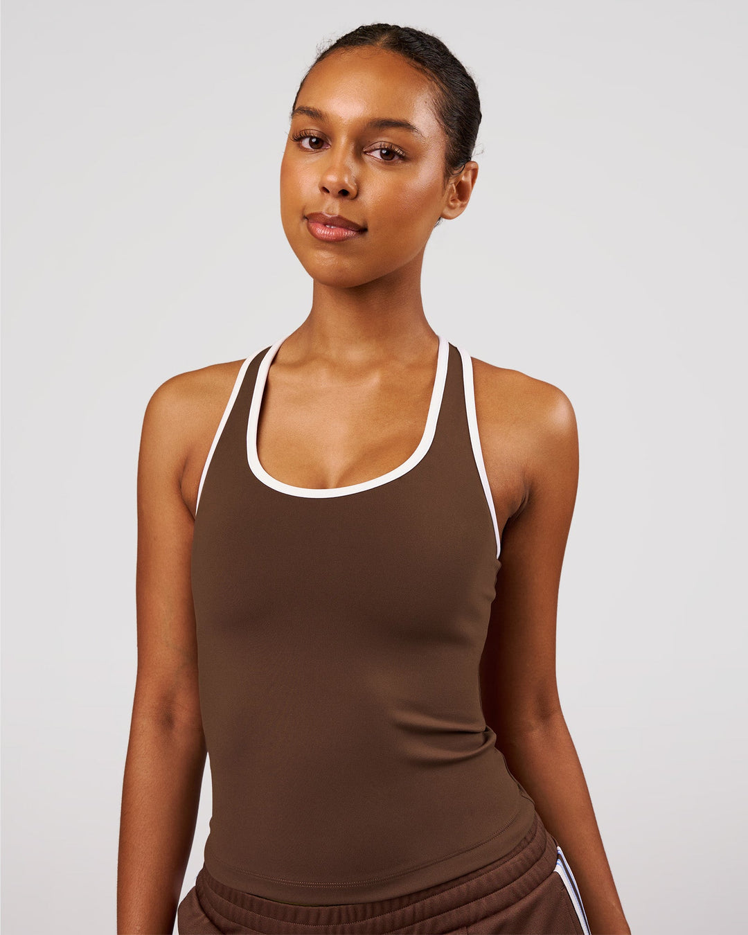 Woman wearing Flow Rep Scoop Neck Tank - Hot Chocolate-White | Model:Jordan | Size:XS - view 1