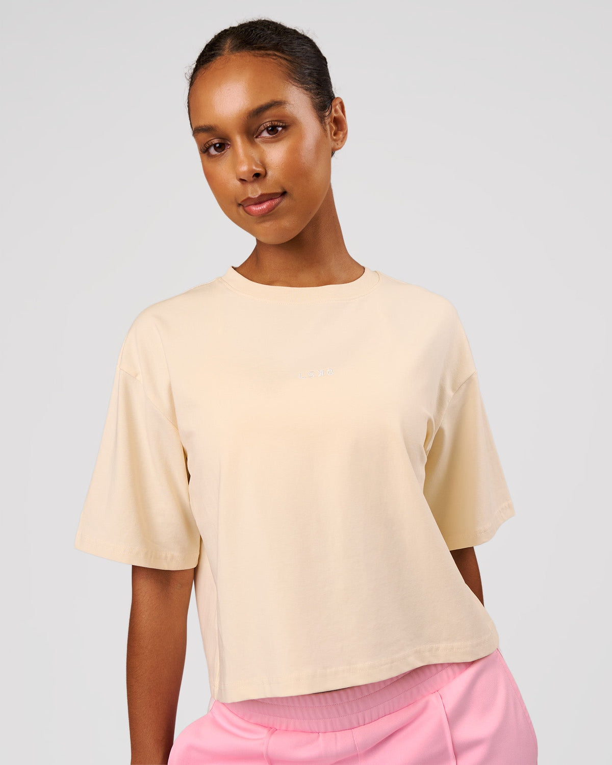 Woman wearing Go-To Heavyweight FlxCotton Skimmer Tee - Vanilla Bean-White | Model:Jordan | Size:XS - view 1