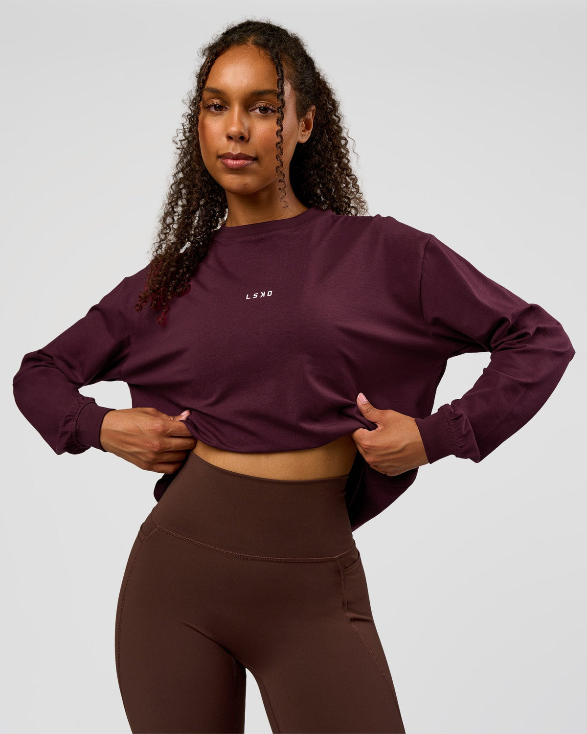 Woman wearing Go-To Long Sleeve FLXCotton Oversized Tee - Cherry Lacquer-White | Model:Jordan | Size:XS