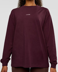 Woman wearing Go-To Long Sleeve FLXCotton Oversized Tee - Cherry Lacquer-White | Model:Jordan | Size:XS | Thumbnail Index: 1