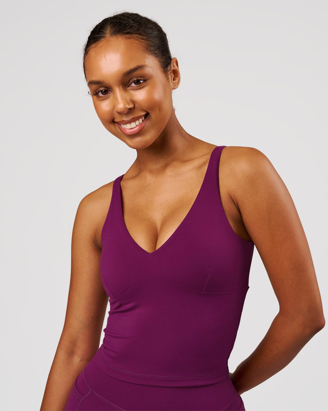 Woman wearing Vitality Active Tank - Plum Caspia | Model:Jordan | Size:XS - view 1