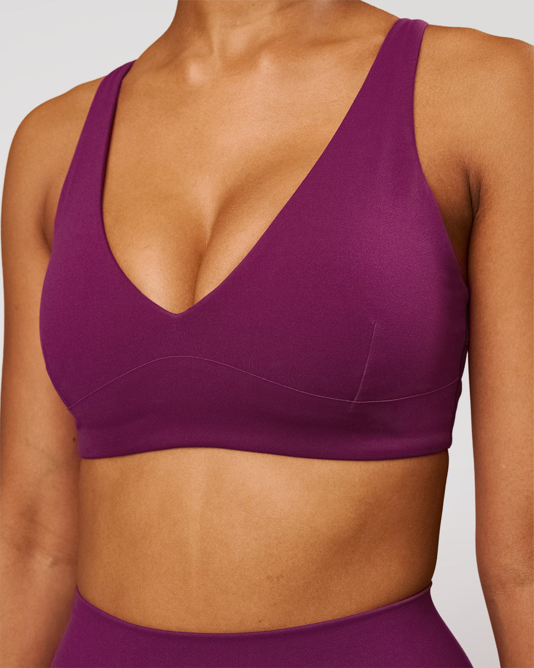 Woman wearing Vitality Sports Bra - Plum Caspia | Model:Jordan | Size:XS - view 1