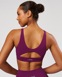 Woman wearing Vitality Sports Bra - Plum Caspia | Model:Jordan | Size:XS | Thumbnail Index: 1