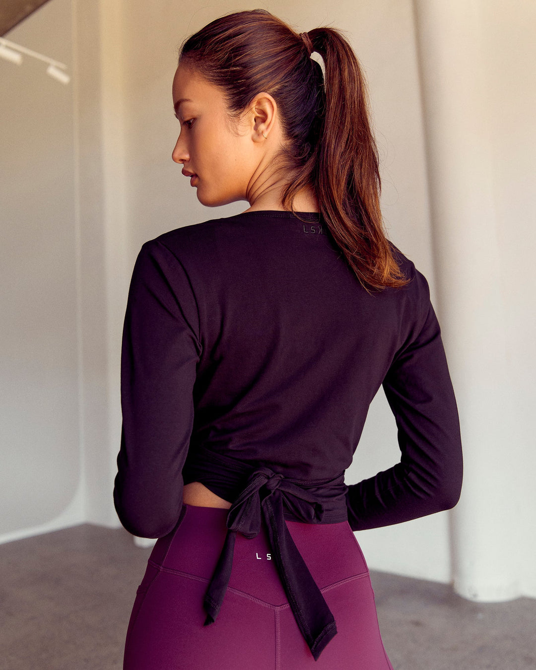 Woman wearing All Day Wrap FLXCotton Long Sleeve Top - Black | Model:Kenni | Size:XS - view 12