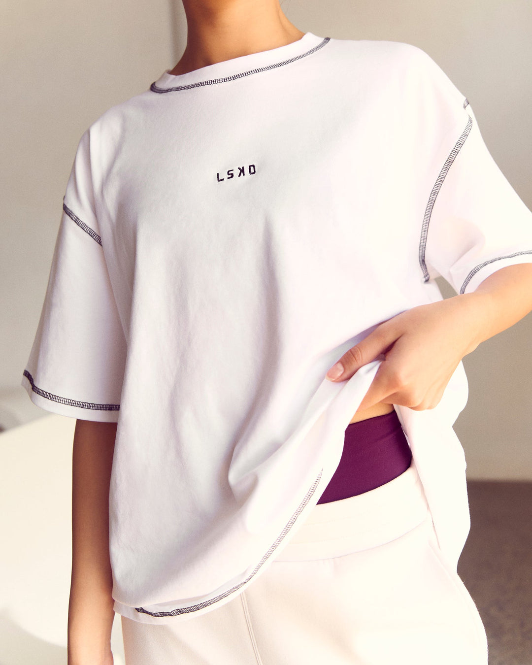 Woman wearing Go-To Contrast Oversized Heavyweight FLXCotton Tee - White-Black | Model:Kenni | Size:XS - view 2