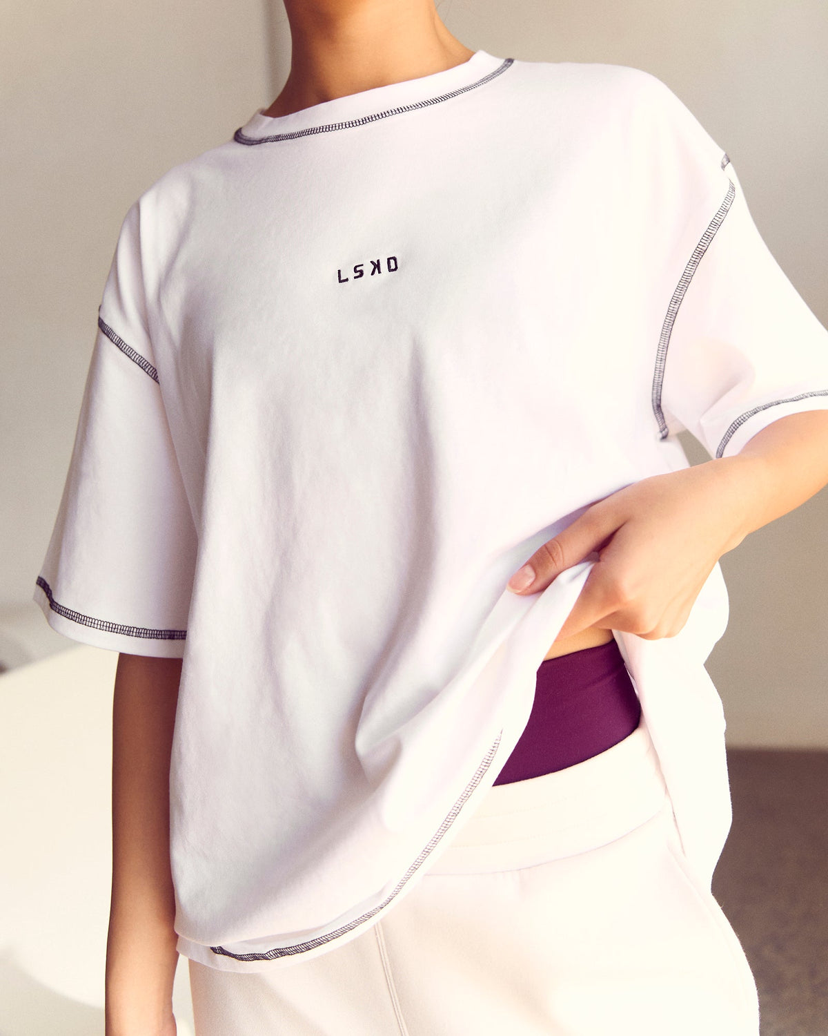 Woman wearing Go-To Contrast Oversized Heavyweight FLXCotton Tee - White-Black | Model:Kenni | Size:XS - view 2