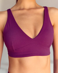 Woman wearing Vitality Sports Bra - Plum Caspia | Model:Kenni | Size:XS | Thumbnail Index: 3