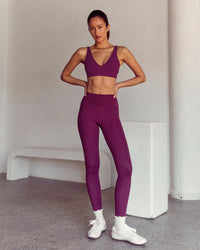 Woman wearing Vitality Sports Bra - Plum Caspia | Model:Kenni | Size:XS | Thumbnail Index: 4