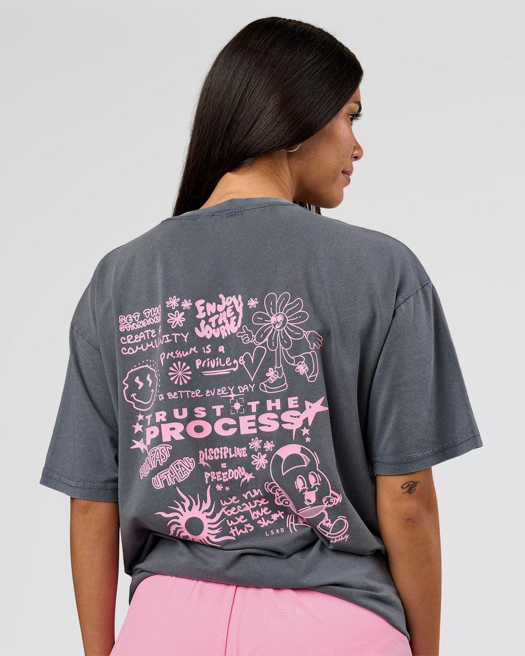 Woman wearing Built On Values FLXCotton Oversized Tee - Dark Storm Washed-Pink Rose | Model:Rhiley | Size:XS