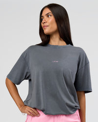 Woman wearing Built On Values FLXCotton Oversized Tee - Dark Storm Washed-Pink Rose | Model:Rhiley | Size:XS