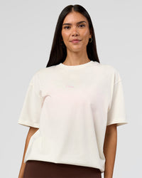 Woman wearing Built On Values FLXCotton Oversized Tee - Off White-Pink Rose | Model:Rhiley | Size:XS