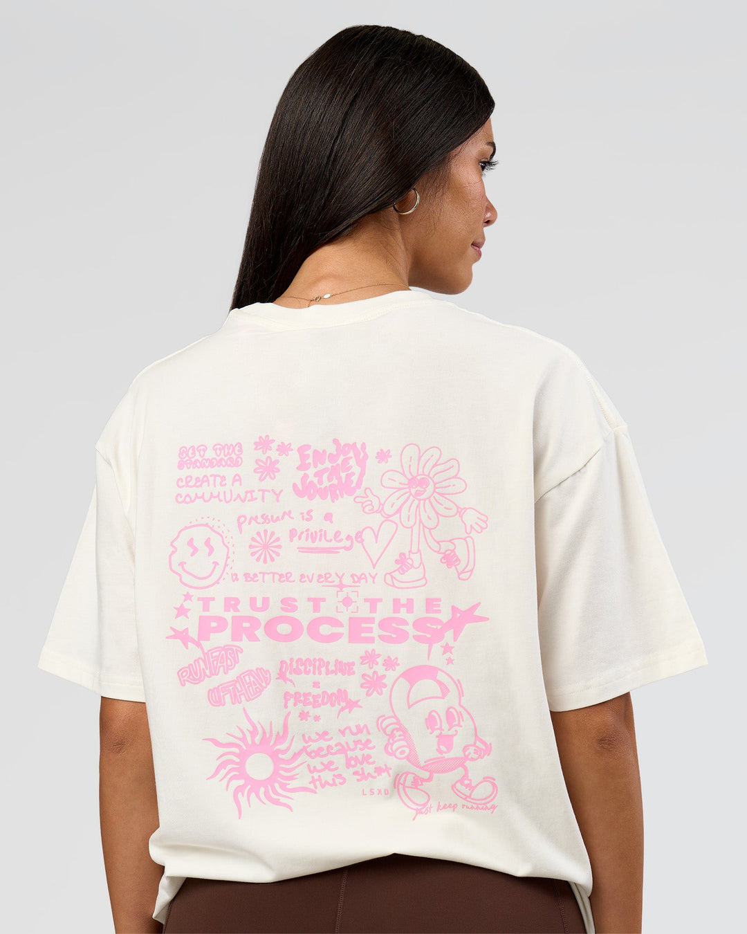 Woman wearing Built On Values FLXCotton Oversized Tee - Off White-Pink Rose | Model:Rhiley | Size:XS - view 2