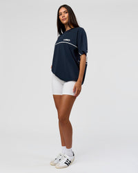 Woman wearing Inline Heavyweight FLXCotton Oversized Tee - Midnight Navy-White | Model:Rhiley | Size:XS | Thumbnail Index: 14