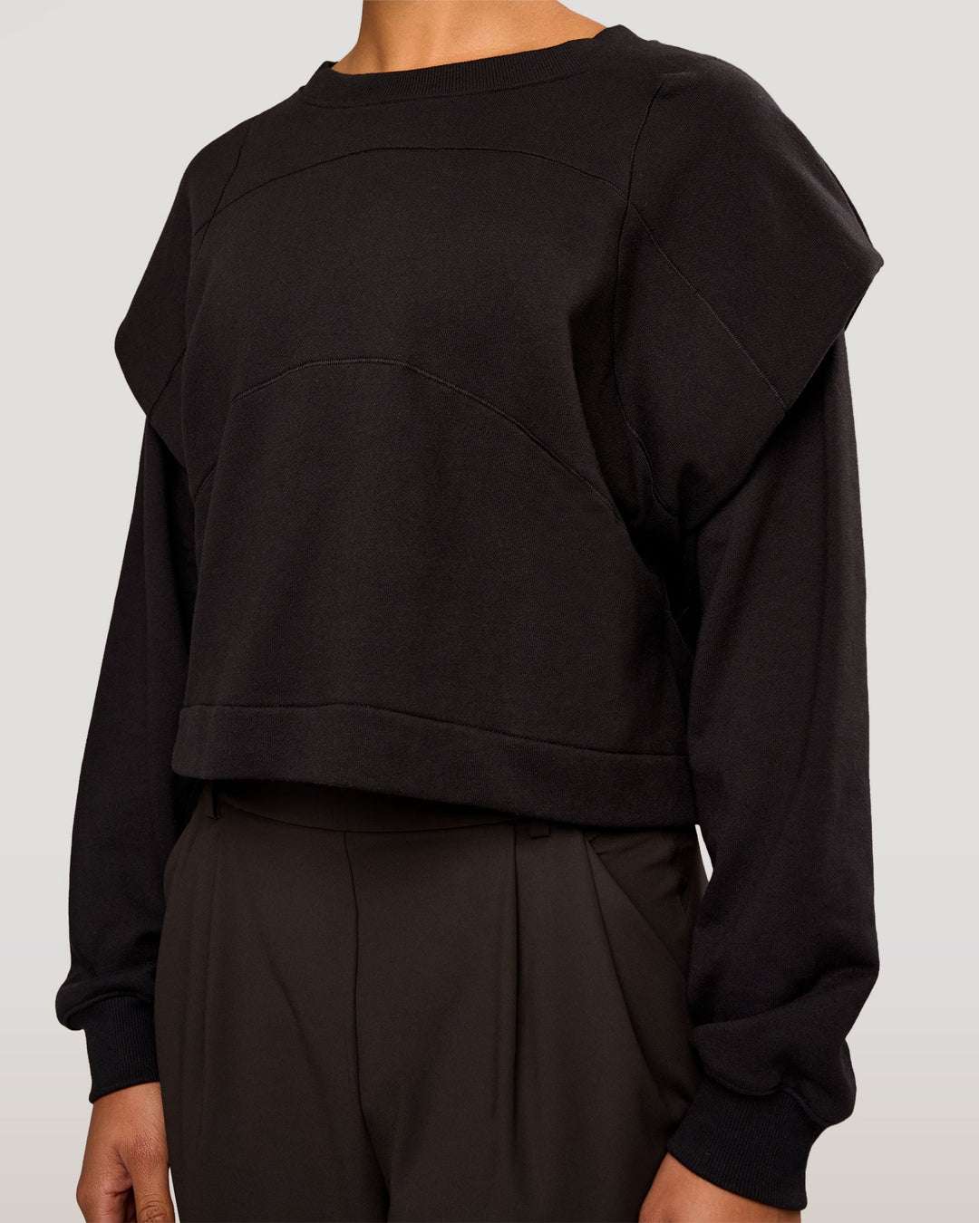 Woman wearing Bend Pleated Shoulder Oversized Sweat - Black | Model:Rosie | Size:XS - view 1