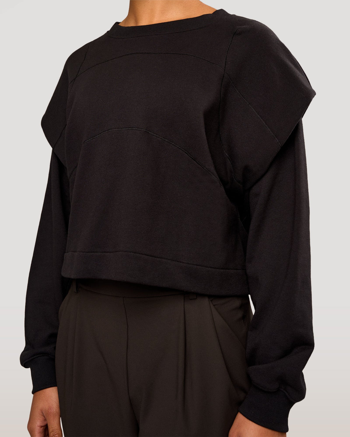 Woman wearing Bend Pleated Shoulder Oversized Sweat - Black | Model:Rosie | Size:XS - view 1