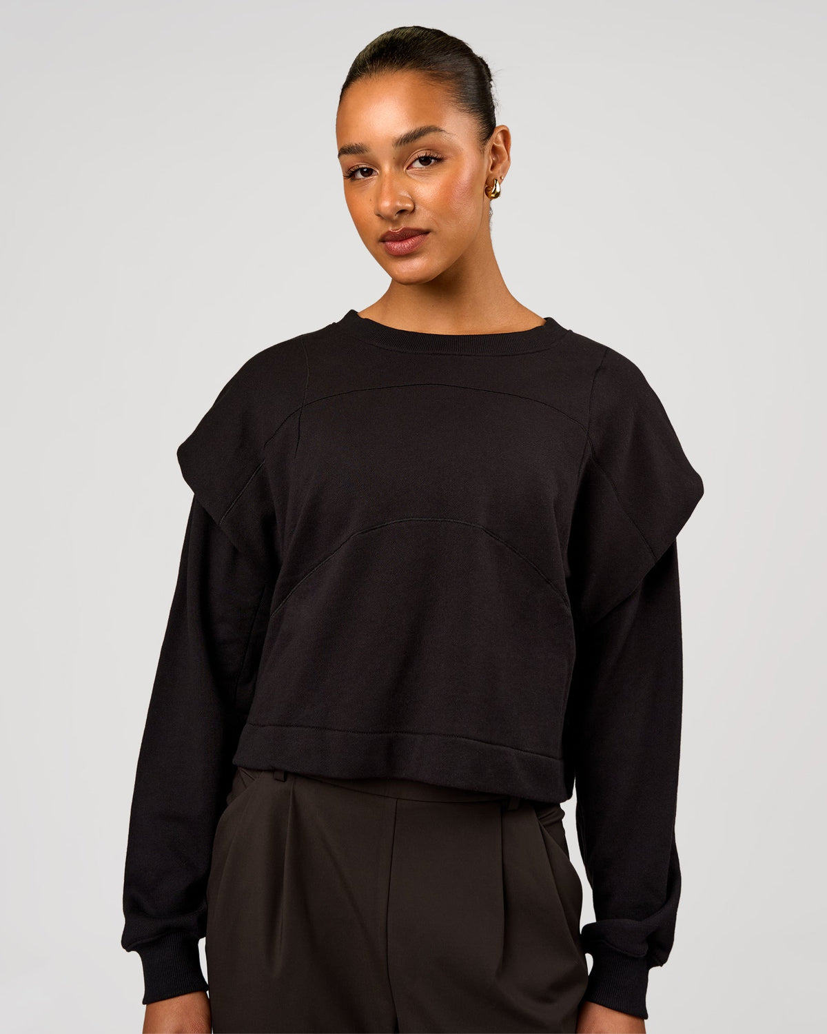 Woman wearing Bend Pleated Shoulder Oversized Sweat - Black | Model:Rosie | Size:XS - view 2