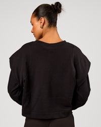 Woman wearing Bend Pleated Shoulder Oversized Sweat - Black | Model:Rosie | Size:XS | Thumbnail Index: 2