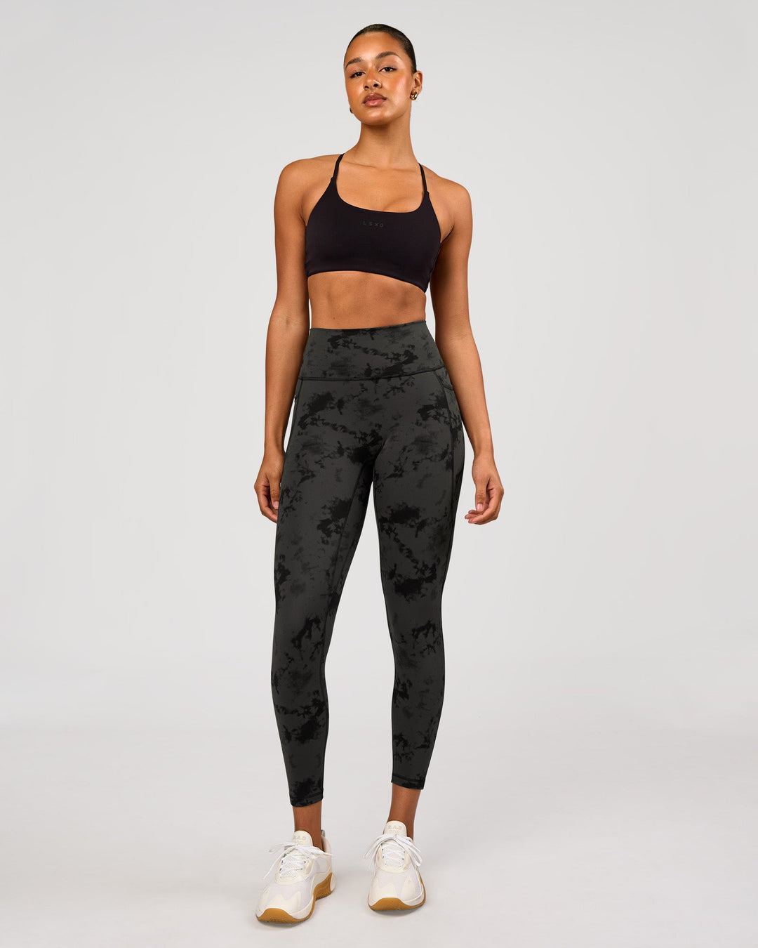 Woman wearing Fusion Ultra High-Rise 7/8 Legging Pockets - Obsidian/Black Tye Dye | Model:Rosie | Size:XS - view 5