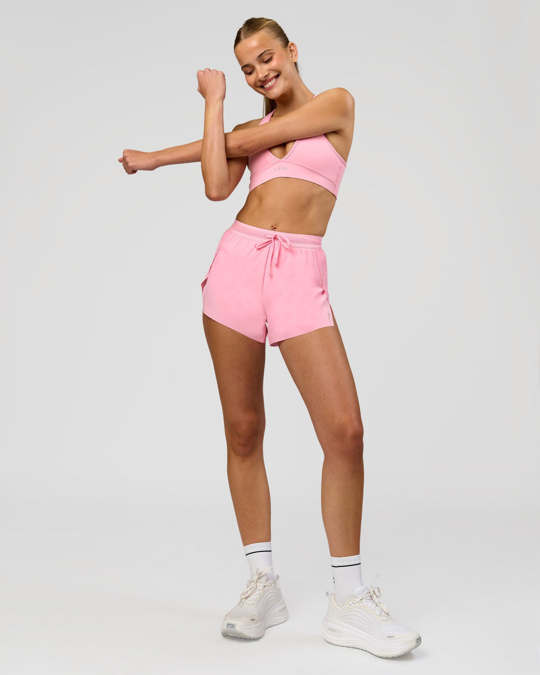 Woman wearing Accelerate 3" High-Rise Running Short - Pink Rose | Model:Taneisha | Size:XS - view 3